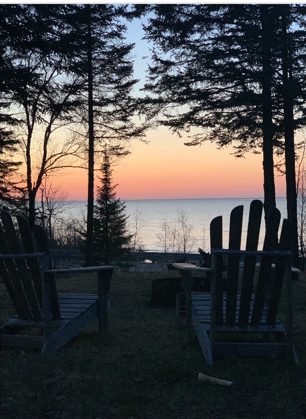 Scenic view of Lake Superior with glimpses of fishing, hiking, and biking activities.